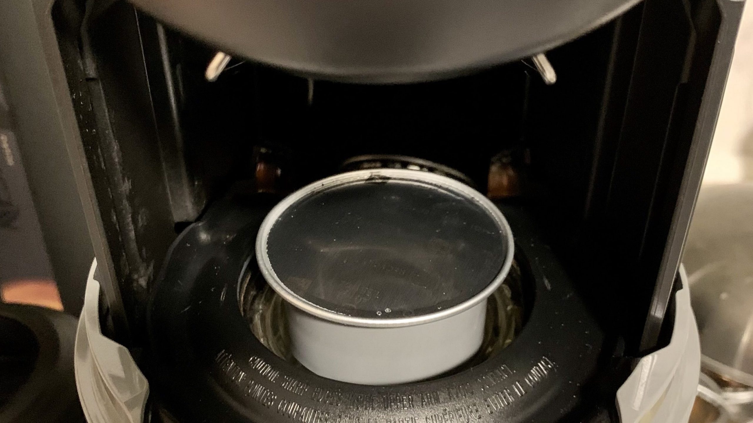 To puncture a Nespresso Vertuo pod, it needs to sit in the holder with the lid facing up